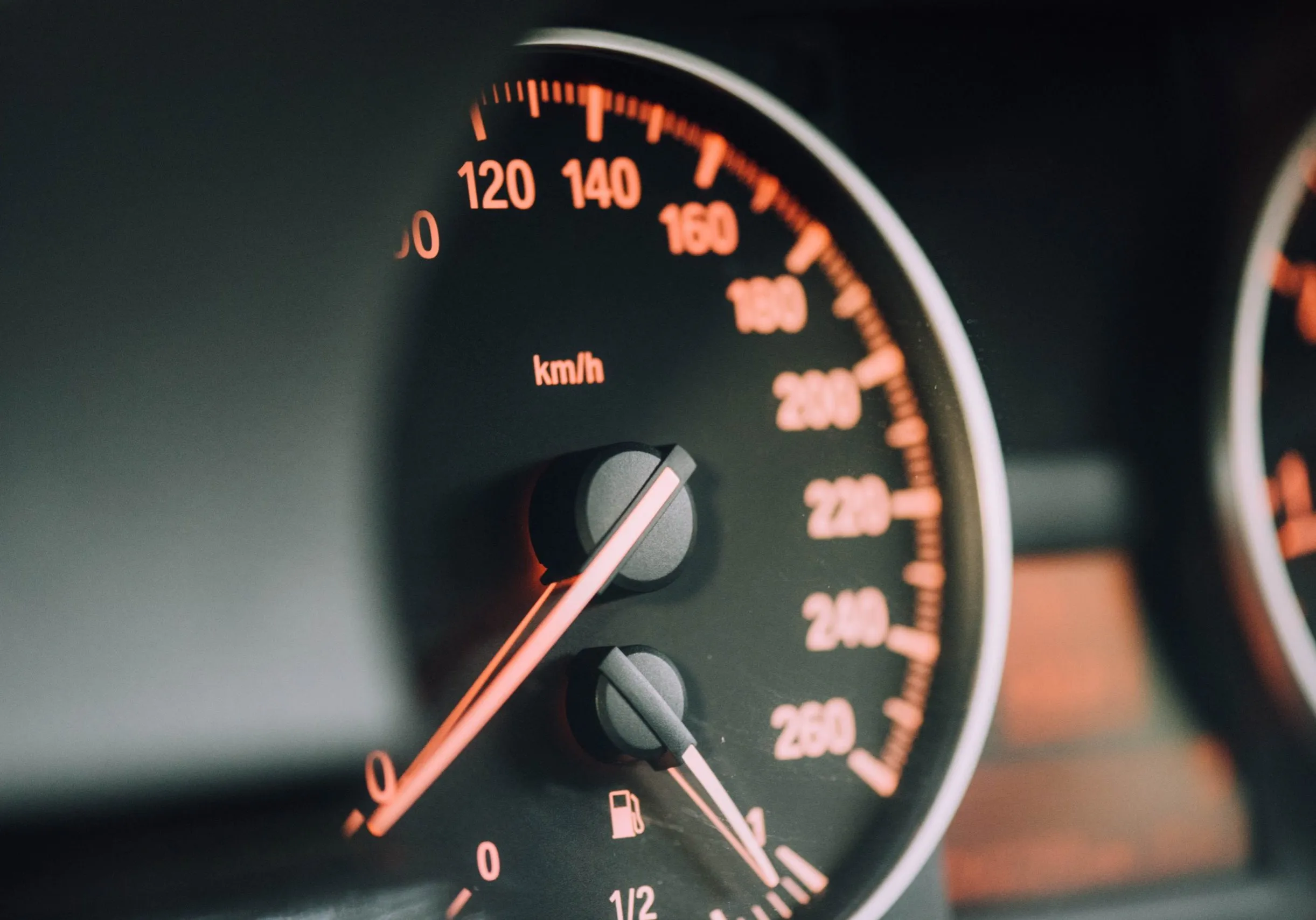 Close-up of a car speedometer dashboard gauge