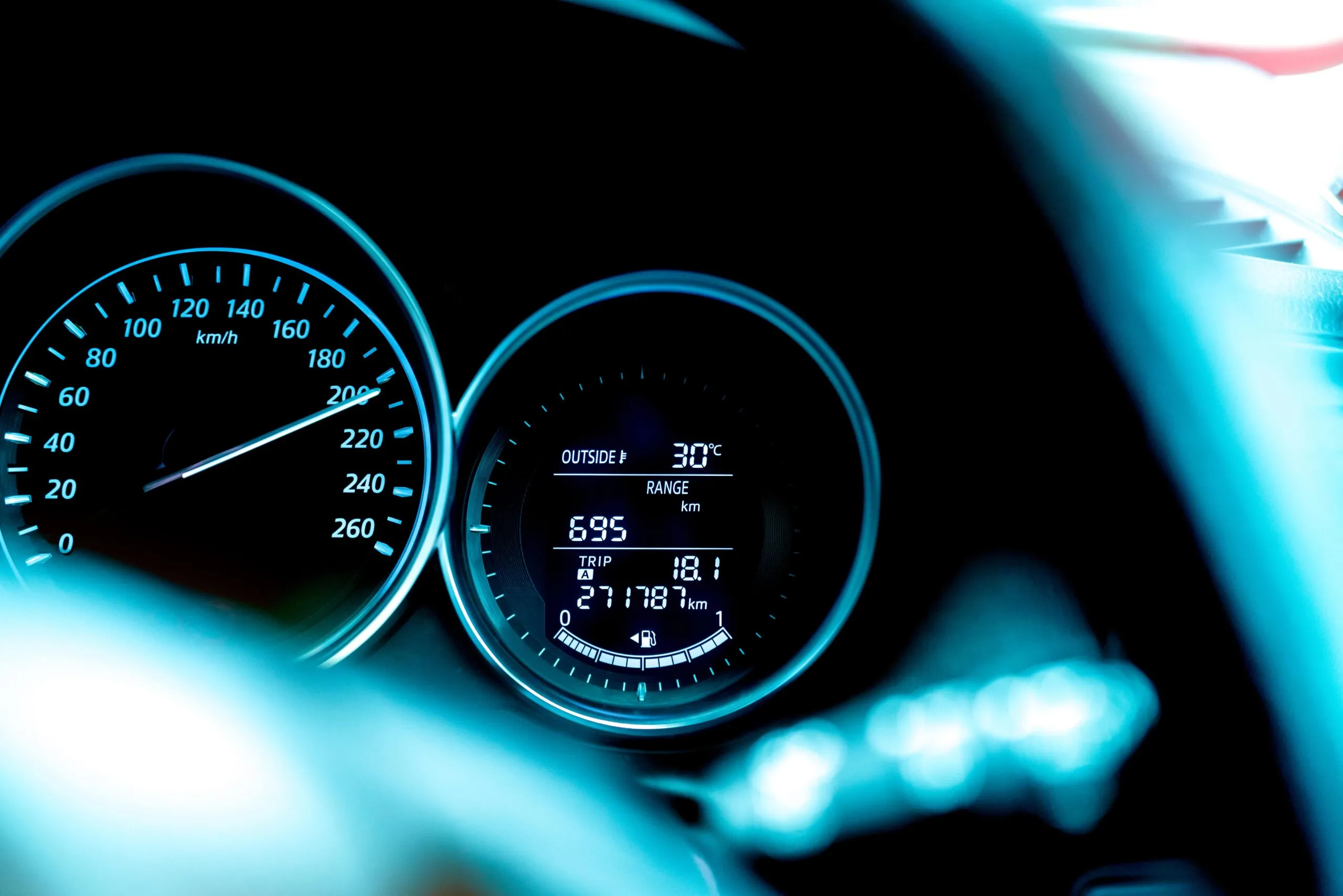 Digital car dashboard showing speedometer, trip and odometer reading